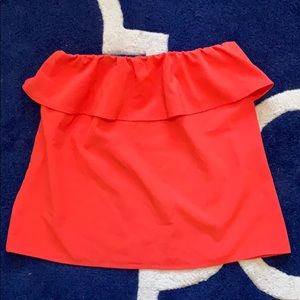 Sleeveless orange tank with ruffle